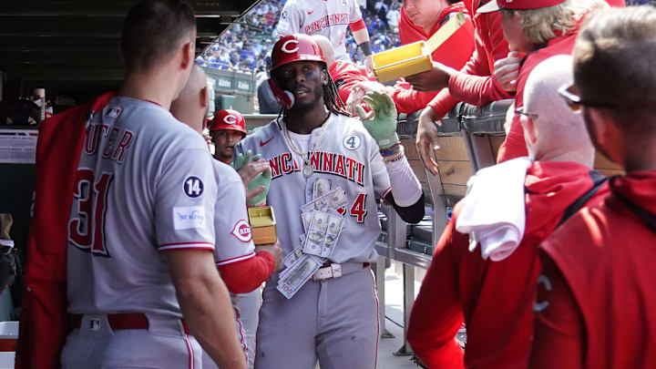Jun 1, 2025; Chicago, Illinois, USA; Cincinnati Reds shortstop Elly De La Cruz (44) is greeted in the dugout after hitting two-run home run against the Chicago Cubs during the sixth inning at Wrigley Field. Mandatory Credit: David Banks-Imagn Images Jun 1, 2025; Chicago, Illinois, USA; Cincinnati Reds shortstop Elly De La Cruz (44) is greeted in the dugout after hitting two-run home run against the Chicago Cubs during the sixth inning at Wrigley Field. Mandatory Credit: David Banks-Imagn Images