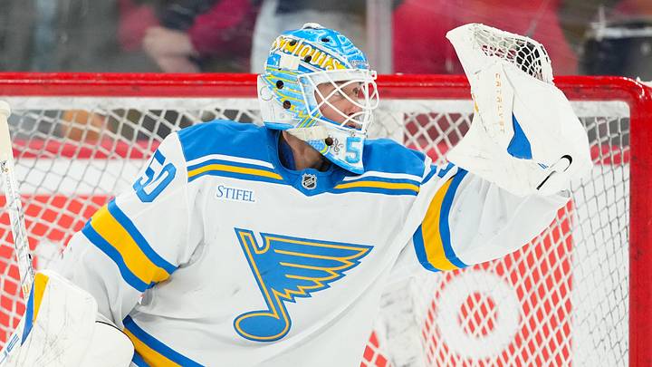 Mar 12, 2026; Raleigh, North Carolina, USA;  St. Louis Blues goaltender Jordan Binnington (50) looks at the puck in his glove during the warmups before the game against the Carolina Hurricanes at Lenovo Center. Mandatory Credit: James Guillory-Imagn Images