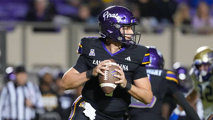 Oct 16, 2025; Greenville, North Carolina, USA; East Carolina Pirates quarterback Katin Houser (4) rolls out of the pocket against the Tulsa Golden Hurricane during the first half at Dowdy-Ficklen Stadium. Mandatory Credit: James Guillory-Imagn Images Oct 16, 2025; Greenville, North Carolina, USA; East Carolina Pirates quarterback Katin Houser (4) rolls out of the pocket against the Tulsa Golden Hurricane during the first half at Dowdy-Ficklen Stadium. Mandatory Credit: James Guillory-Imagn Images