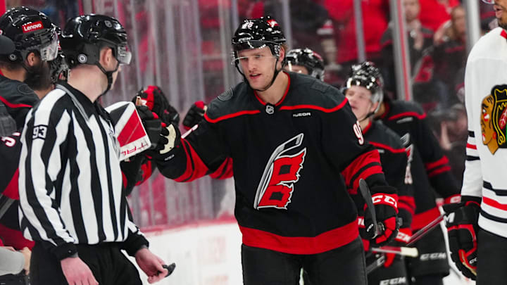 Jan 30, 2025; Raleigh, North Carolina, USA; Carolina Hurricanes right wing Mikko Rantanen (96) celebrates his goal against the Chicago Blackhawks during the second period at Lenovo Center. Mandatory Credit: James Guillory-Imagn Images