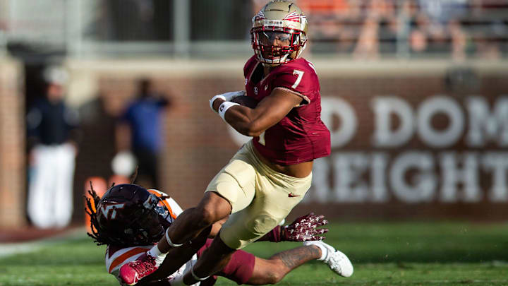 Florida State Seminoles wide receiver Destyn Hill (7) attempts to outrun a tackle.The Florida State Seminoles defeated the Virginia Tech Hokies 39-17 at Doak Campbell Stadium on Saturday, Oct. 7, 2023.