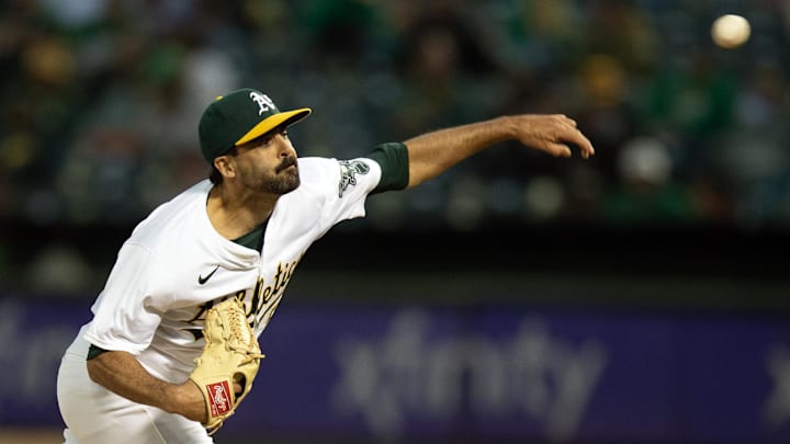 Oakland, California, USA; Oakland Athletics pitcher Scott Alexander (54) delivers a pitch against the Toronto Blue Jays during the eighth inning at Oakland-Alameda County Coliseum.