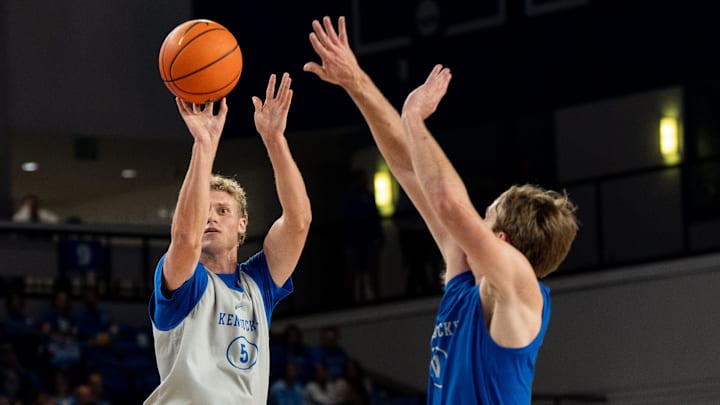 Kentucky Wildcats guard Collin Chandler (5) shoots a three pointer against Kentucky Wildcats guard Travis Perry (11) during the Kentucky Blue-White preseason event on Friday, Oct. 18, 2024 at the Memorial Coliseum. Kentucky Wildcats guard Collin Chandler (5) shoots a three pointer against Kentucky Wildcats guard Travis Perry (11) during the Kentucky Blue-White preseason event on Friday, Oct. 18, 2024 at the Memorial Coliseum.