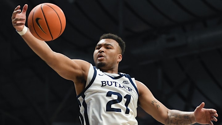 Feb 10, 2024; Indianapolis, Indiana, USA;  Butler Bulldogs guard Pierre Brooks (21) rebounds the ball against the Providence Friars during the second half at Hinkle Fieldhouse. Mandatory Credit: Robert Goddin-Imagn Images