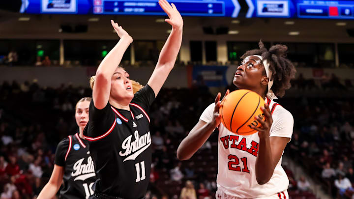 Mar 21, 2025; Columbia, South Carolina, USA; Utah Utes forward Maye Toure (21) looks to shoot over Indiana Hoosiers forward Karoline Striplin (11) in the second half at Colonial Life Arena. Mar 21, 2025; Columbia, South Carolina, USA; Utah Utes forward Maye Toure (21) looks to shoot over Indiana Hoosiers forward Karoline Striplin (11) in the second half at Colonial Life Arena.