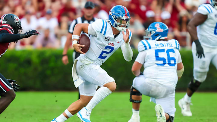Oct 5, 2024; Columbia, South Carolina, USA; Mississippi Rebels quarterback Jaxson Dart (2) rushes against the South Carolina Gamecocks in the second quarter at Williams-Brice Stadium. Mandatory Credit: Jeff Blake-Imagn Images