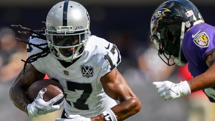 Sep 15, 2024; Baltimore, Maryland, USA; Las Vegas Raiders wide receiver Davante Adams (17) runs with the ball as Baltimore Ravens cornerback Marlon Humphrey (44) defends during the second half at M&T Bank Stadium. Mandatory Credit: Reggie Hildred-Imagn Images