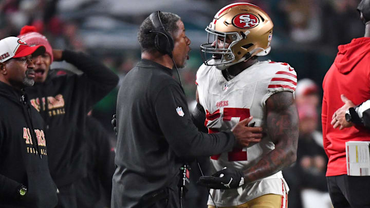 Dec 3, 2023; Philadelphia, Pennsylvania, USA; San Francisco 49ers linebacker Dre Greenlaw (57) talks a with a coach after being ejected against the Philadelphia Eagles during the third quarter at Lincoln Financial Field. Dec 3, 2023; Philadelphia, Pennsylvania, USA; San Francisco 49ers linebacker Dre Greenlaw (57) talks a with a coach after being ejected against the Philadelphia Eagles during the third quarter at Lincoln Financial Field.