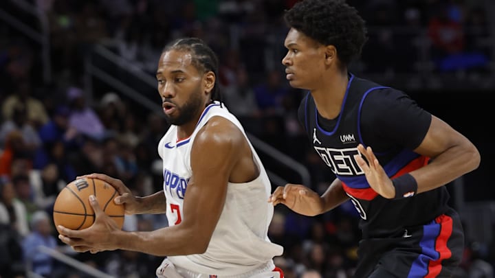 Feb 2, 2024; Detroit, Michigan, USA;  LA Clippers forward Kawhi Leonard (2) dribbles defended by Detroit Pistons forward Ausar Thompson (9) in the first half at Little Caesars Arena. Mandatory Credit: Rick Osentoski-Imagn Images