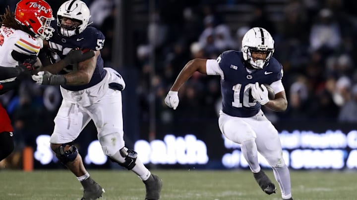Penn State running back Nicholas Singleton (10) runs with the ball against the Maryland Terrapins during the third quarter at Beaver Stadium. 