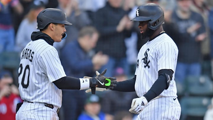 Chicago White Sox center fielder Luis Robert Jr. (right) celebrates with third baseman Miguel Vargas (left) after hitting a two-run home run against the Boston Red Sox at Rate Field. 