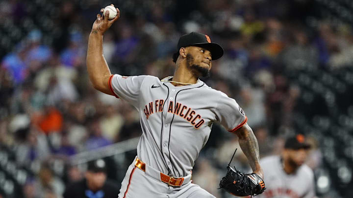 Jun 11, 2025; Denver, Colorado, USA; San Francisco Giants relief pitcher Camilo Doval (75)  delivers a pitch in the ninth inning against the Colorado Rockies at Coors Field.