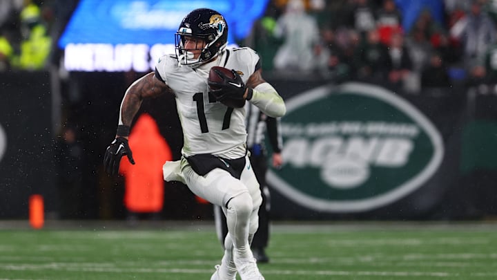 Dec 22, 2022; East Rutherford, New Jersey, USA; Jacksonville Jaguars tight end Evan Engram (17) runs with the ball against the New York Jets during the second half at MetLife Stadium. 
