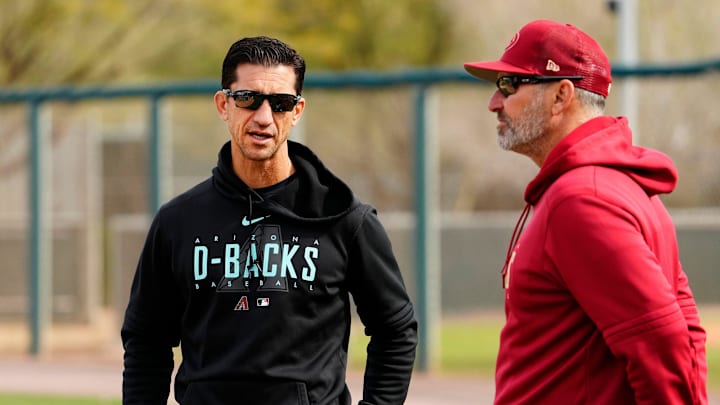 Arizona Diamondbacks general manager Mike Hazen talks to manager Torey Lovullo during spring training workouts at Salt River Fields in Scottsdale on Feb. 17, 2023.