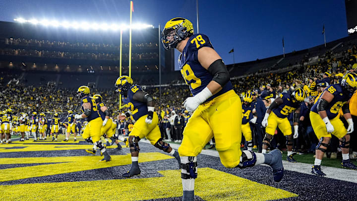 Michigan offensive lineman Jeffrey Persi (79) warms up with his group before the Michigan State game at Michigan Stadium in Ann Arbor on Saturday, Oct. 26, 2024.
