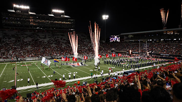 Aug 30, 2025; Tucson, Arizona, USA; Arizona Wildcats team runs out before the start of the Hawaii Rainbow Warriors at the Arizona Stadium. Mandatory Credit: Aryanna Frank-Imagn Images