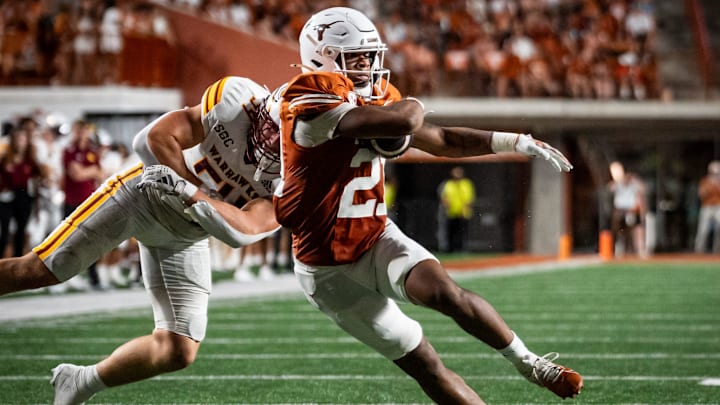 Texas Longhorns wide receiver Ryan Niblett (21) evades a tackle from Louisiana Monroe Warhawks linebacker Brett Drillette (54) to continue to run the ball in the first half of the Texas Longhorns' game against the ULM Warhawks at Darrell K Royal Texas Memorial Stadium in Austin, Sept. 21, 2024.