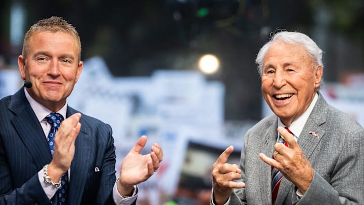 Analysts Kirk Herbstreit, left, and Lee Corso get ready to begin ESPN College Game Day, filmed at the University of Texas on the South Mall, ahead of the Longhorns' game against the Georgia Bulldogs in Austin, Oct. 19, 2024. Analysts Kirk Herbstreit, left, and Lee Corso get ready to begin ESPN College Game Day, filmed at the University of Texas on the South Mall, ahead of the Longhorns' game against the Georgia Bulldogs in Austin, Oct. 19, 2024.