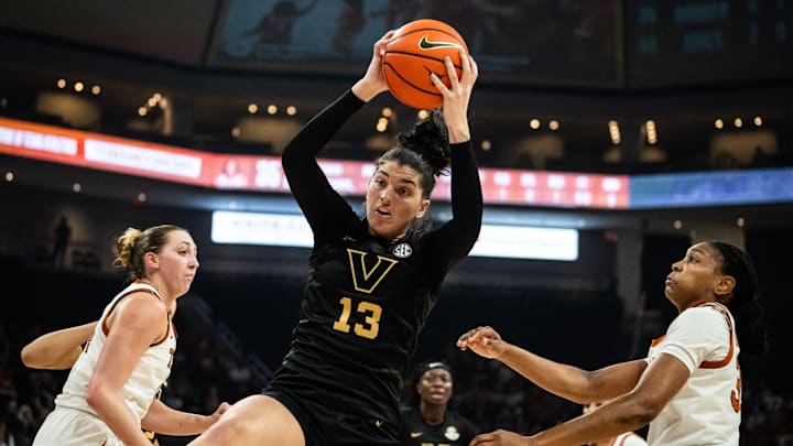 Vanderbilt Commodores guard Justine Pissott (13) brings the rebound down under the net over Texas Longhorns forwards Taylor Jones (44) and Madison Booker (35) in the first half as the Texas Longhorns take on the Vanderbilt Commodores at the Moody Center, Feb. 5, 2025.