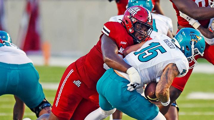 Jacksonville State's Darrell Prater tackles Coastal Carolina's Ethan Vasko during college football action at Burgess-Snow Field AmFirst Stadium in Jacksonville, Alabama August 29, 2024. (Dave Hyatt / Special to the Gadsden Times) Jacksonville State's Darrell Prater tackles Coastal Carolina's Ethan Vasko during college football action at Burgess-Snow Field AmFirst Stadium in Jacksonville, Alabama August 29, 2024. (Dave Hyatt / Special to the Gadsden Times)