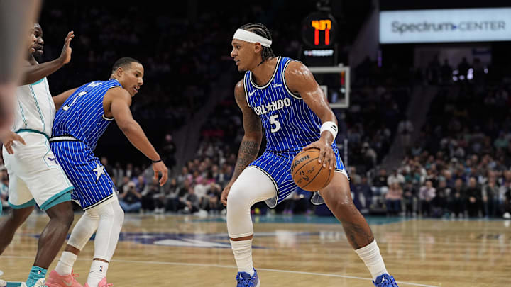 Oct 30, 2025; Charlotte, North Carolina, USA; Orlando Magic forward Paolo Banchero (5) handles the ball against the Charlotte Hornets during the first quarter at Spectrum Center. Mandatory Credit: Jim Dedmon-Imagn Images Oct 30, 2025; Charlotte, North Carolina, USA; Orlando Magic forward Paolo Banchero (5) handles the ball against the Charlotte Hornets during the first quarter at Spectrum Center. Mandatory Credit: Jim Dedmon-Imagn Images