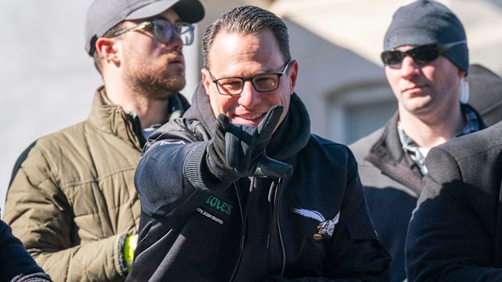 Pennsylvania Governor, Josh Shapiro waves to Eagles fans during the Philadelphia Eagles Super Bowl 59 victory parade.