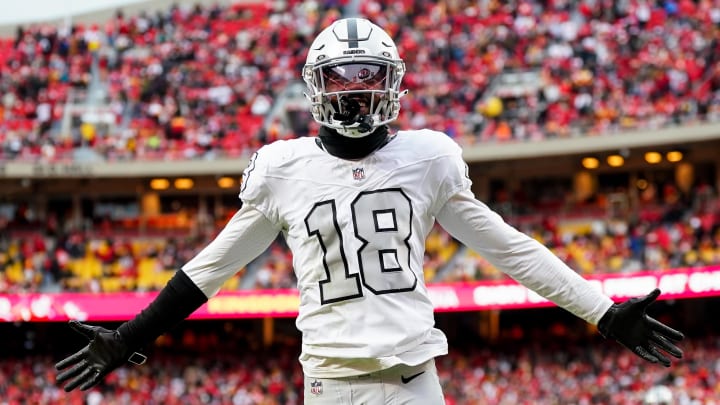 Dec 25, 2023; Kansas City, Missouri, USA; Las Vegas Raiders cornerback Jack Jones (18) interacts with the crowd after a play during the second half against the Kansas City Chiefs at GEHA Field at Arrowhead Stadium. Mandatory Credit: Jay Biggerstaff-USA TODAY Sports
