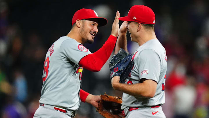 Sep 25, 2024; Denver, Colorado, USA; St. Louis Cardinals third base Nolan Arenado (28) and relief pitcher Ryan Helsley (56) celebrate defeating the Colorado Rockies at Coors Field. Mandatory Credit: Ron Chenoy-Imagn Images