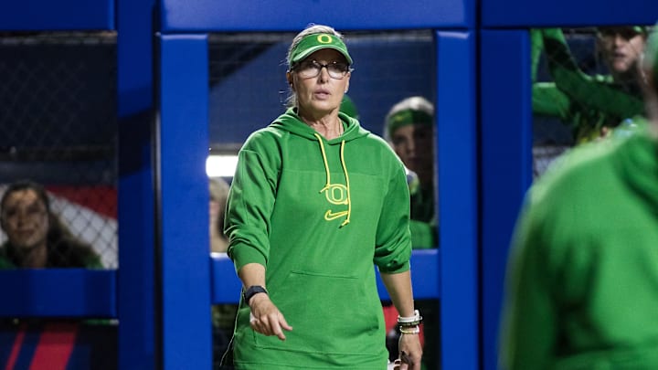 May 29, 2025; Oklahoma City, OK, USA;  Oregon Ducks head coach Melyssa Lombardi comes out to talk to the umpire in the third inning against the UCLA Bruins during the NCAA Softball Women's College World Series at Devon Park. Mandatory Credit: Brett Rojo-Imagn Images