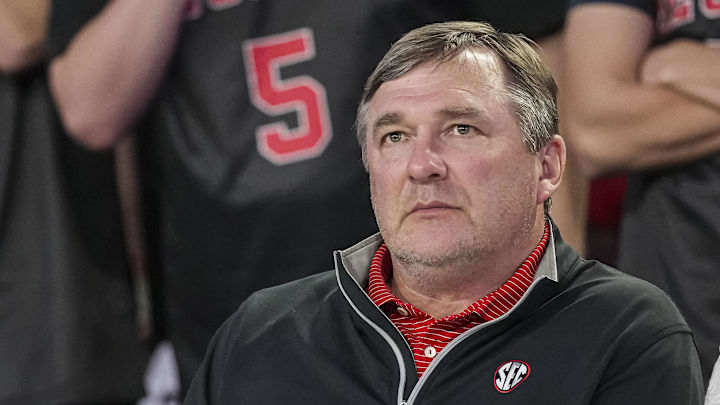 Feb 25, 2025; Athens, Georgia, USA; Georgia Bulldogs head football coach Kirby Smart watches the basketball game between Georgia and the Florida Gators during the second half at Stegeman Coliseum. Mandatory Credit: Dale Zanine-Imagn Images