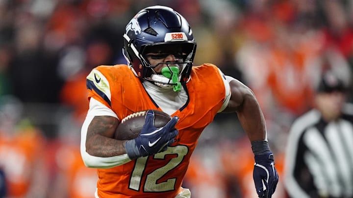 Dec 14, 2025; Denver, Colorado, USA; Denver Broncos running back RJ Harvey (12) runs for a gain during the fourth quarter against the Green Bay Packers at Empower Field at Mile High. 
