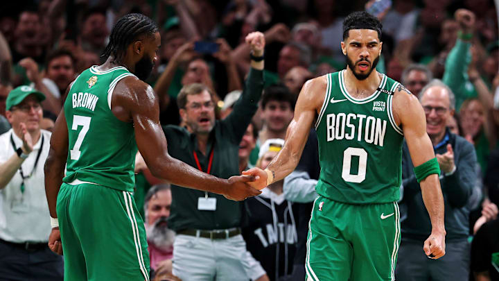 Jun 17, 2024; Boston, Massachusetts, USA; Boston Celtics forward Jayson Tatum (0) celebrates with guard Jaylen Brown (7) after a play against the Dallas Mavericks in game five of the 2024 NBA Finals at TD Garden. Mandatory Credit: Peter Casey-Imagn Images