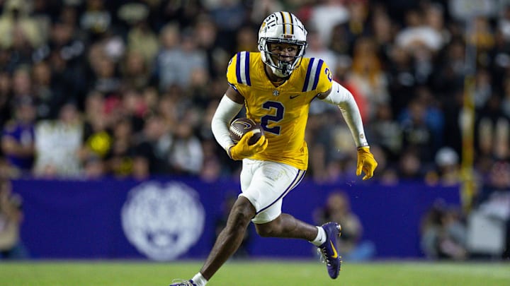 Nov 23, 2024; Baton Rouge, Louisiana, USA;  LSU Tigers wide receiver Kyren Lacy (2) runs after a catch against the Vanderbilt Commodores during the first half at Tiger Stadium. Mandatory Credit: Stephen Lew-Imagn Images