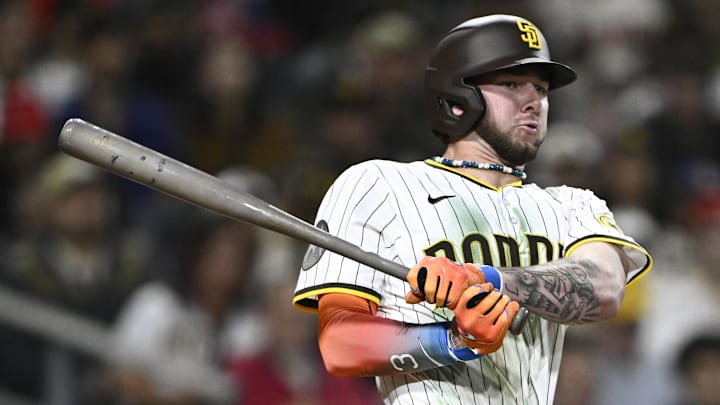 May 12, 2025; San Diego, California, USA; San Diego Padres center fielder Jackson Merrill (3) hits a triple during the eighth inning against the Los Angeles Angels at Petco Park. Mandatory Credit: Denis Poroy-Imagn Images