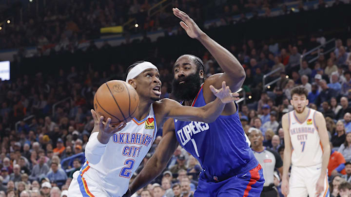 Feb 22, 2024; Oklahoma City, Oklahoma, USA; Oklahoma City Thunder guard Shai Gilgeous-Alexander (2) moves to the basket beside LA Clippers guard James Harden (1) during the second quarter at Paycom Center. Mandatory Credit: Alonzo Adams-Imagn Images