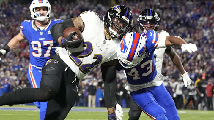 Baltimore Ravens running back Derrick Henry (22) runs the ball during the second quarter against Buffalo Bills cornerback Dorian Strong (43) at Highmark Stadium. Baltimore Ravens running back Derrick Henry (22) runs the ball during the second quarter against Buffalo Bills cornerback Dorian Strong (43) at Highmark Stadium.