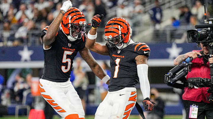 Cincinnati Bengals wide receiver Tee Higgins (5) and wide receiver Ja'Marr Chase (1) dance after Chase scored a touchdown in the 4th quarter to beat the Dallas Cowboys in Monday Night Football at AT&T Stadium in Arlington, Texas on Monday, December 9, 2024. Cincinnati Bengals wide receiver Tee Higgins (5) and wide receiver Ja'Marr Chase (1) dance after Chase scored a touchdown in the 4th quarter to beat the Dallas Cowboys in Monday Night Football at AT&T Stadium in Arlington, Texas on Monday, December 9, 2024.