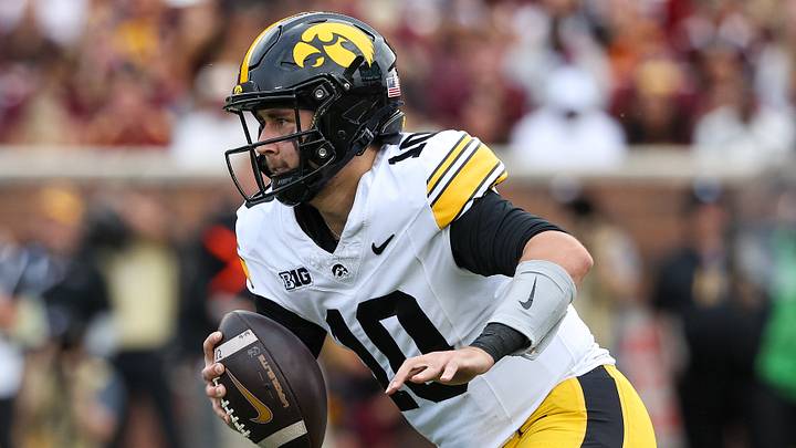 Oct 24, 2026; Minneapolis, Minnesota, USA; Iowa Hawkeyes quarterback Jeremy Hecklinski (10) runs with the ball against the Minnesota Golden Gophers during the first half at Huntington Bank Stadium. Mandatory Credit: Matt Krohn-Imagn Images