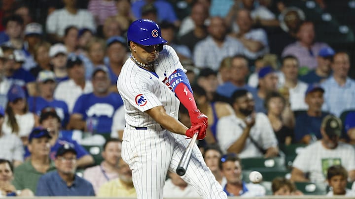 Jun 17, 2024; Chicago, Illinois, USA; Chicago Cubs third baseman Christopher Morel (5) singles against the San Francisco Giants during the fifth inning at Wrigley Field. Mandatory Credit: Kamil Krzaczynski-USA TODAY Sports