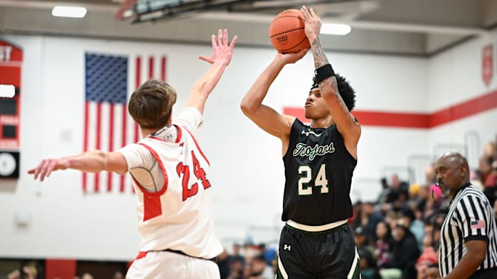 Wauwatosa West guard Jalen Brown shoots the ball over Wauwatosa East guard Parker Mitchellin a game Friday, December 12, 2025, at Wauwatosa East High School in Wauwatosa, Wisconsin. West won 74-63. Wauwatosa West guard Jalen Brown shoots the ball over Wauwatosa East guard Parker Mitchellin a game Friday, December 12, 2025, at Wauwatosa East High School in Wauwatosa, Wisconsin. West won 74-63.