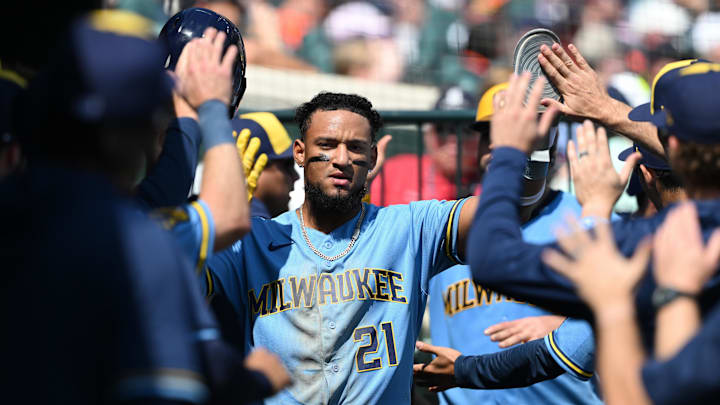 Apr 23, 2026; Detroit, Michigan, USA;  Milwaukee Brewers right fielder Luis Matos (21) celebrates in the dugout after scoring on a two-run double by teammate Blake Perkins (not pictured) against the Detroit Tigers in the seventh inning at Comerica Park. Mandatory Credit: Lon Horwedel-Imagn Images