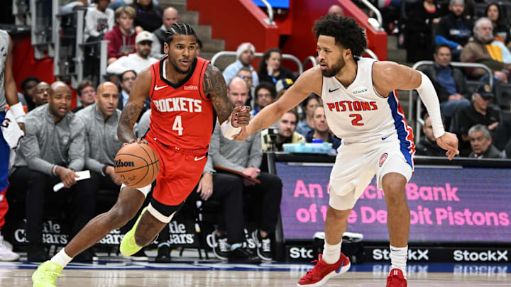 Nov 10, 2024; Detroit, Michigan, USA;  Houston Rockets guard Jalen Green (4) drives past Detroit Pistons guard Cade Cunningham (2) in the first quarter at Little Caesars Arena. Mandatory Credit: Lon Horwedel-Imagn Images