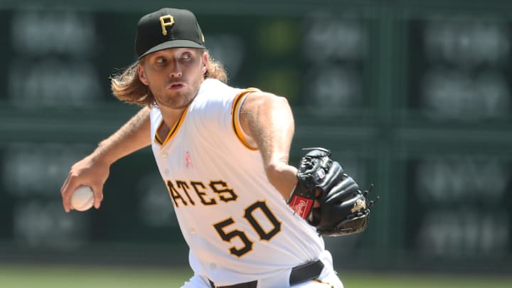 May 11, 2025; Pittsburgh, Pennsylvania, USA;  Pittsburgh Pirates starting pitcher Carmen Mlodzinski (50) delivers a pitch against the Atlanta Braves during the first inning at PNC Park. Mandatory Credit: Charles LeClaire-Imagn Images