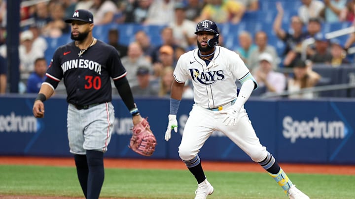 Tampa Bay Rays third baseman Caminero looks on from first base after hitting a two RBI single against the Minnesota Twins in the third inning at Tropicana Field. 