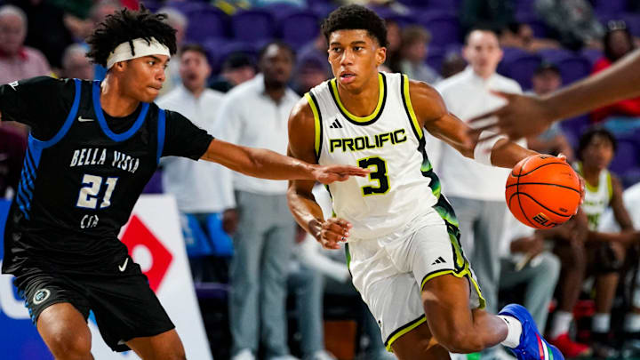Prolific Prep Crew guard Bruce Branch II (3) drives to the basket as CIA-Bella Vista Bears guard Lyris Robinson (21) guards him during the first quarter of a City of Palms Classic Signature Series game at Suncoast Credit Union Arena in Fort Myers, Fla., on Friday, Dec. 19, 2025.