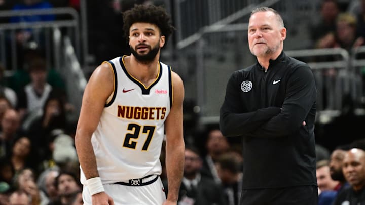 Feb 27, 2025; Milwaukee, Wisconsin, USA; Denver Nuggets head coach Michael Malone and guard Jamal Murray (27) look on in the fourth quarter against the Milwaukee Bucks at Fiserv Forum. Mandatory Credit: Benny Sieu-Imagn Images