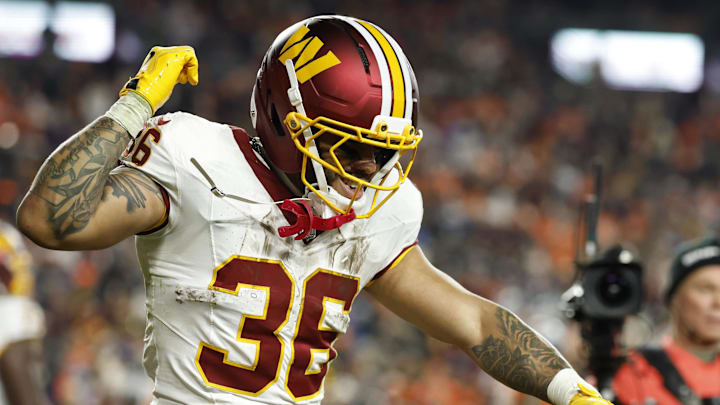 Nov 30, 2025; Landover, Maryland, USA; Washington Commanders running back Chris Rodriguez Jr. (36) celebrates after scoring a touchdown against the Denver Broncos in the second quarter at Northwest Stadium. Mandatory Credit: Geoff Burke-Imagn Images