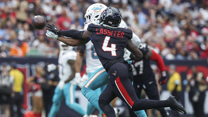 Houston Texans cornerback Kamari Lassiter (4) defends against a pass intended for Miami Dolphins wide receiver Jaylen Waddle (17) during the second quarter at NRG Stadium.