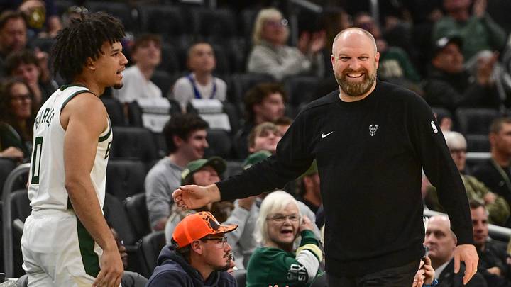 Oct 5, 2026; Milwaukee, Wisconsin, USA; Milwaukee Bucks head coach Taylor Jenkins enjoys a play with guard Brayden Burries (0) in the third quarter at Fiserv Forum. Mandatory Credit: Benny Sieu-Imagn Images Oct 5, 2026; Milwaukee, Wisconsin, USA; Milwaukee Bucks head coach Taylor Jenkins enjoys a play with guard Brayden Burries (0) in the third quarter at Fiserv Forum. Mandatory Credit: Benny Sieu-Imagn Images