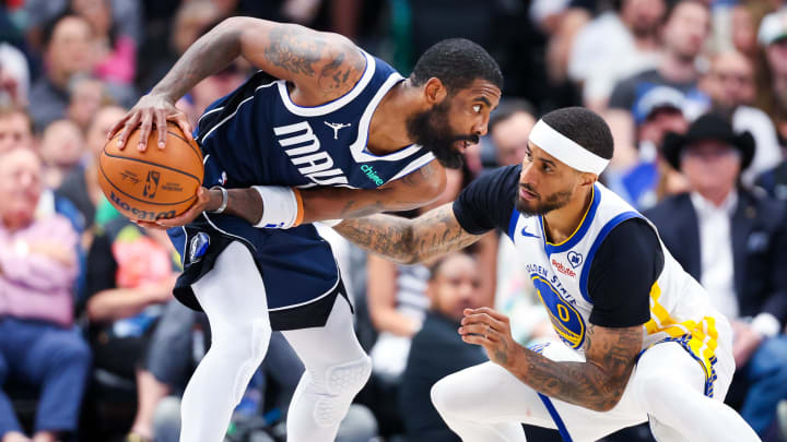 Apr 5, 2024; Dallas, Texas, USA;  Dallas Mavericks guard Kyrie Irving (11) looks to score as Golden